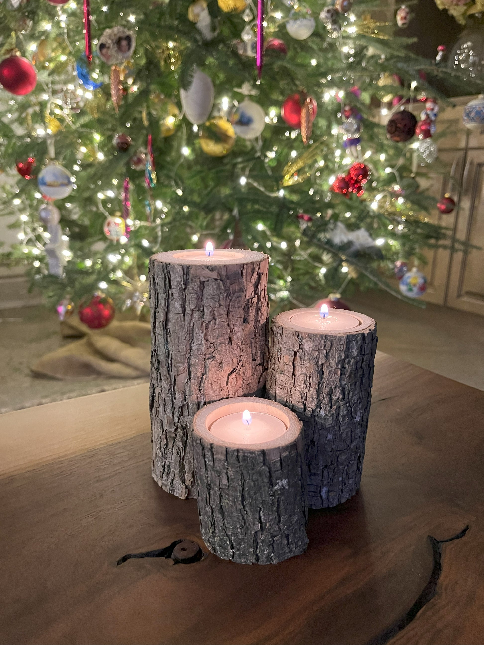 All 3 sizes (2.5-inch, 4-inch, and 5.5-inch tall) live-edge tea-light candle stands set together in front of a cozy Christmas Tree)