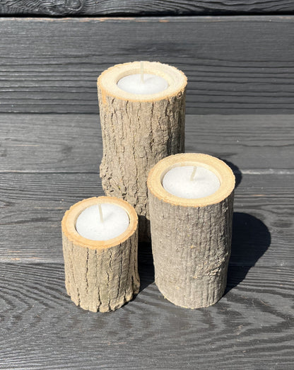 All 3 sizes (2.5-inch, 4-inch, and 5.5-inch tall) live-edge tea-light candle stands set together with a black wooden board background